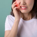 Toothache,Jaw,Pain.,Asian,Young,Woman,Touching,Her,Mouth,,Expression,