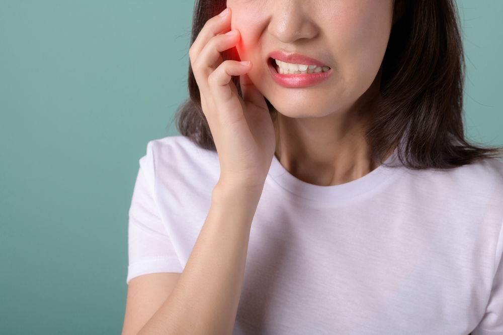Toothache,Jaw,Pain.,Asian,Young,Woman,Touching,Her,Mouth,,Expression,